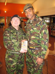 Johnson Beharry VC receiving a replacement NIV Bible (He lost his original in battle)