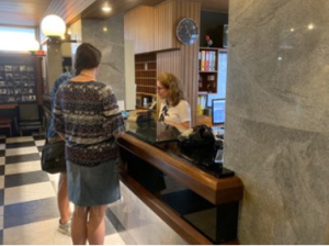 One of the hotels accepting New Testaments and other Christian material from two members of the mission team.