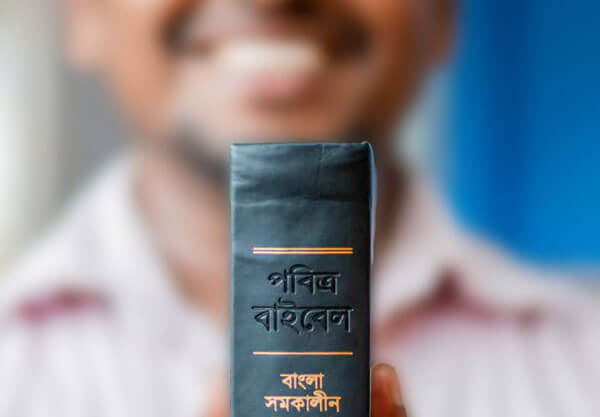 Man holding new Bible translation